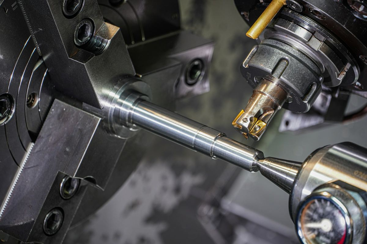 Carbide insert tool holder turning a steel bar in a lathe